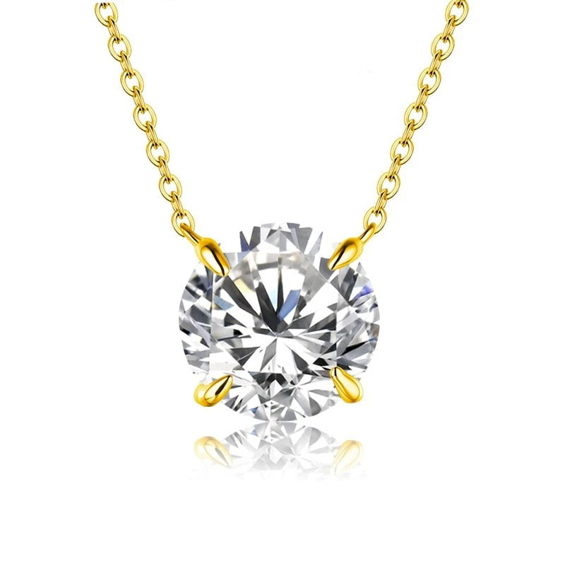 Gold necklace with a large diamond pendant on a white background, featuring the brand 'Charming Light'.
