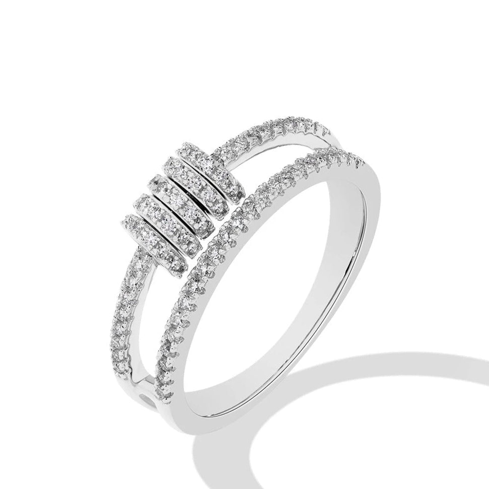 Silver ring with diamond accents on a white background